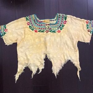 Embroidered distressed crop top.